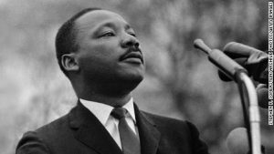 An image of Dr. King in front of a microphone